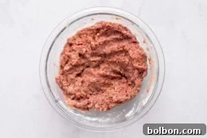 Dividing the meat mixture into two portions.