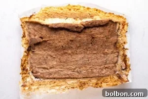 Cooked doner kebab being broken into pieces.
