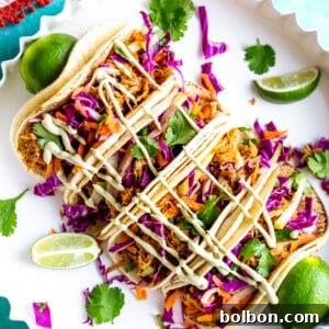 Delicious Slow Cooker Mexican Pulled Pork Tacos with fresh toppings