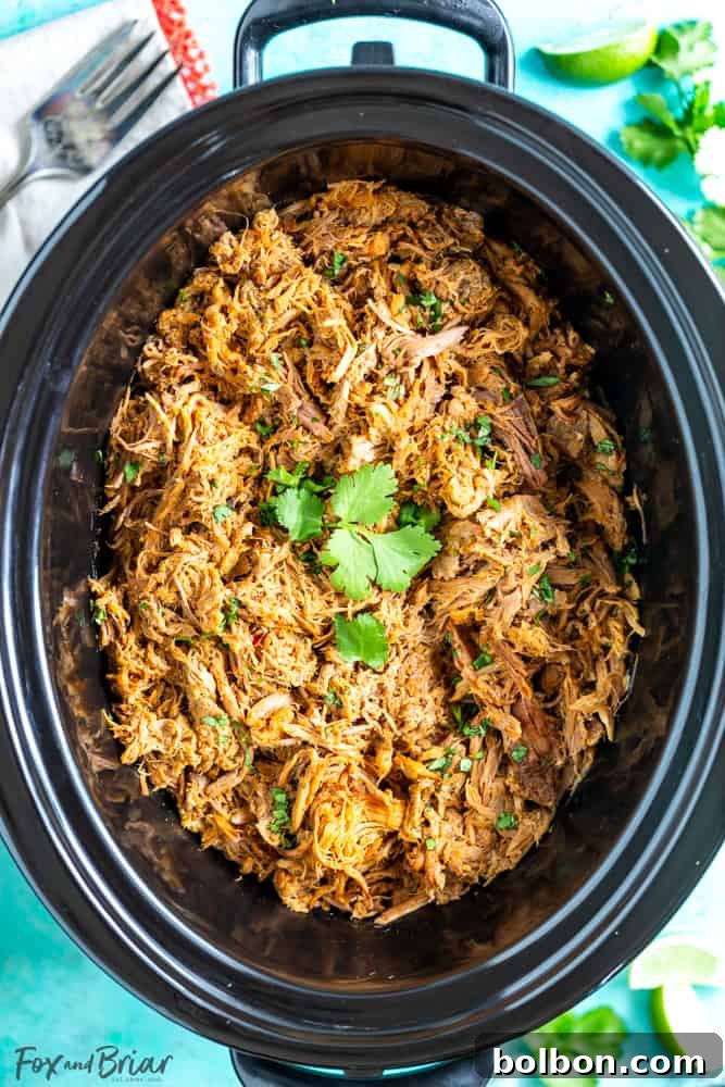 Crispy Slow Cooker Pork Carnitas 3 Close-up of succulent Slow Cooker Pork Carnitas, ready to be shredded. A versatile Mexican pulled pork for various dishes.