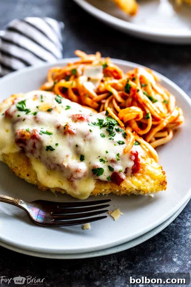 Delicious and healthy Oven Baked Chicken Parmesan recipe, quick and easy for a weeknight dinner. Crispy baked Parmesan crusted chicken breast ready in about thirty minutes. A perfect Italian recipe, even better than Olive Garden copycat. Healthy panko crusted chicken.