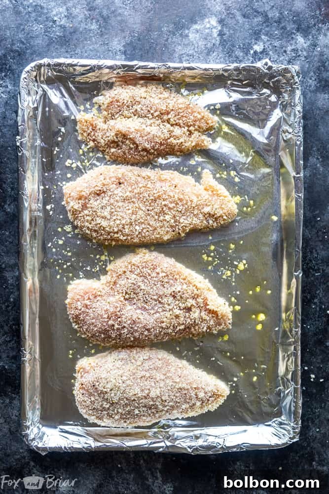 Perfectly baked Oven Baked Chicken Parmesan with melted, bubbly cheese and crispy crust. A healthy, quick, and easy dinner recipe for busy weeknights, an Italian classic.