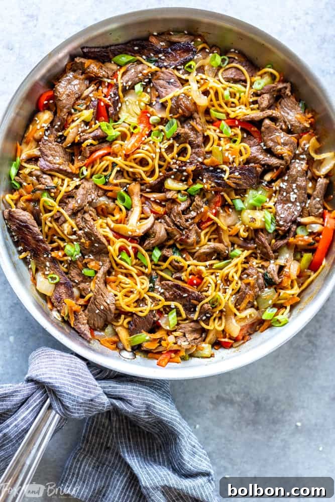 Close-up of Beef Ramen Noodle Stir Fry, showcasing tender beef slices, colorful bell peppers, and savory ramen noodles coated in a rich, glossy sauce.