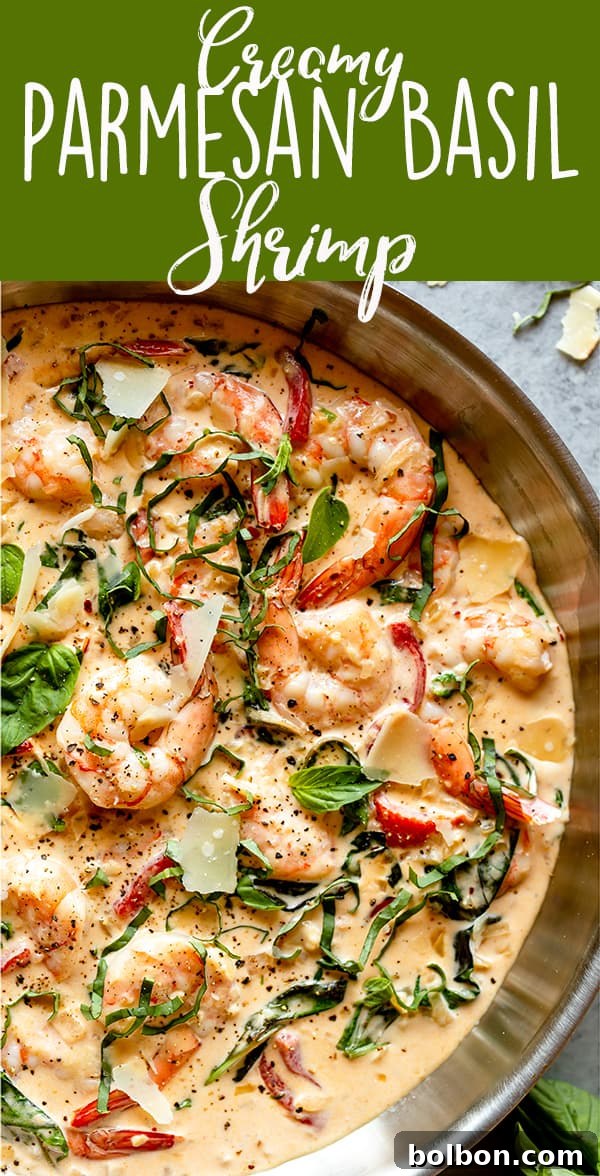 Overhead shot of Creamy Parmesan Basil Shrimp, showing the delicious presentation with pasta underneath.