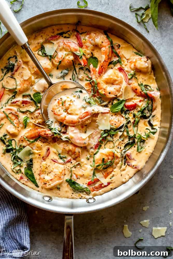Creamy Parmesan Basil Shrimp plated elegantly with a sprinkle of fresh basil, ready to be served.