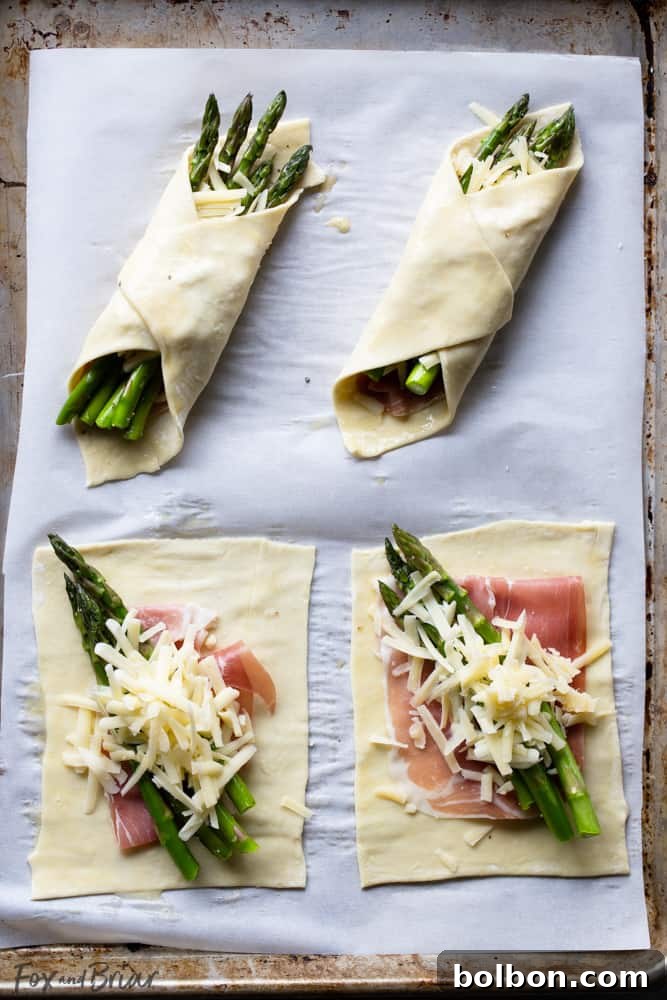 Close-up of a perfectly baked Prosciutto Asparagus Puff Pastry Bundle, showcasing the golden pastry and vibrant filling.