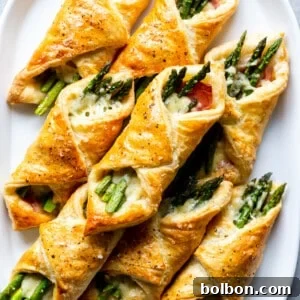 Finished Asparagus Puff Pastry Bundles on a plate.