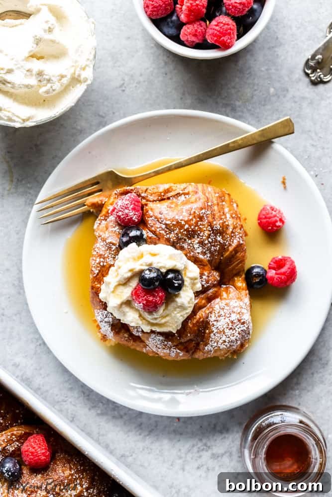 Overnight Croissant French Toast Strata 7 One serving of Croissant French Toast with whipped cream, blueberries, and raspberries