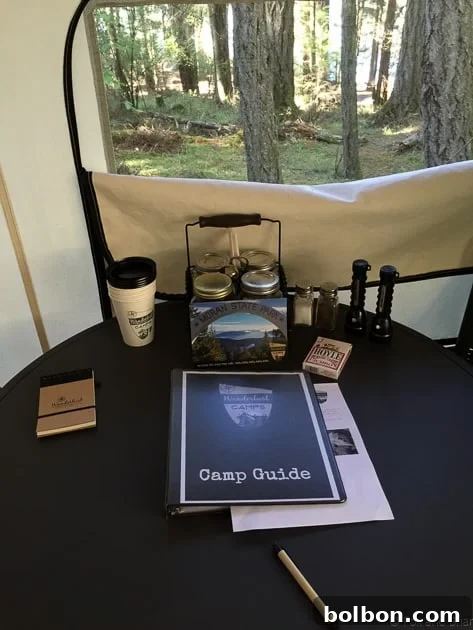 Luxurious glamping tent interior on Orcas Island, featuring a bed, dresser, and cozy amenities