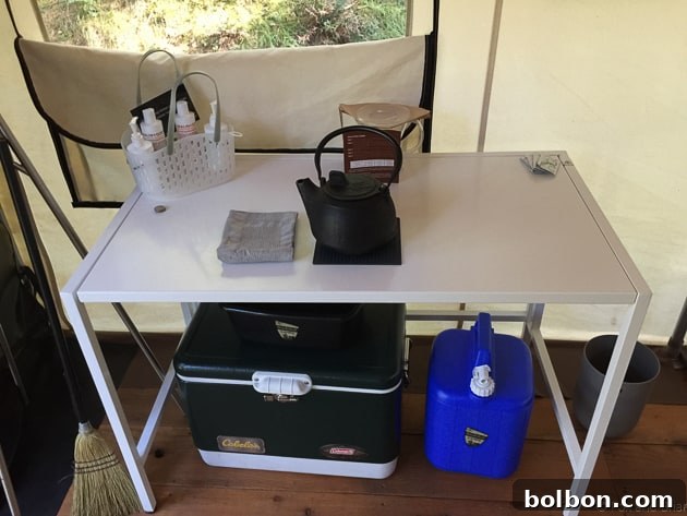 Close-up of glamping tent interior, showing details like a kettle, coffee maker, and decor