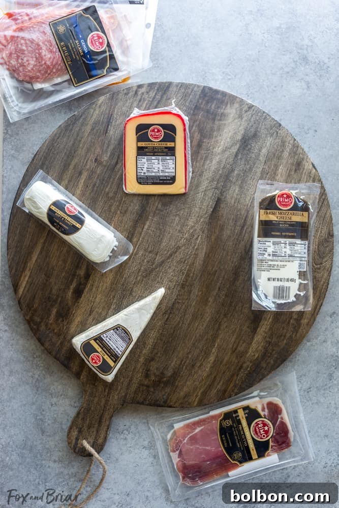 Close-up of a charcuterie board featuring an array of cheeses, crackers, grapes, and cured meats, showcasing the Primo Taglio brand from Safeway.