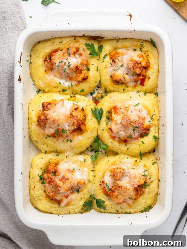 Baked polenta squares topped with tomato sauce and cheese