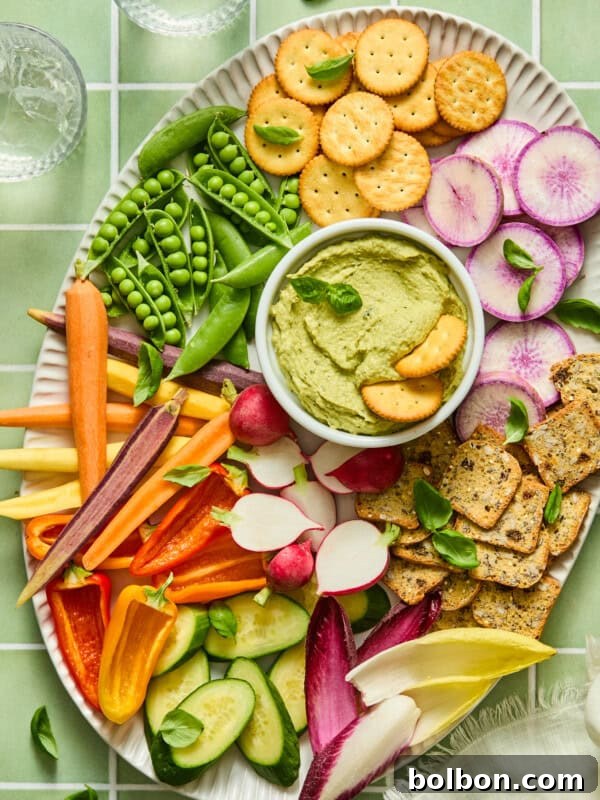 Creamy Tuna and Avocado Dip 3 Colorful vegetable and cracker platter with green hummus dip