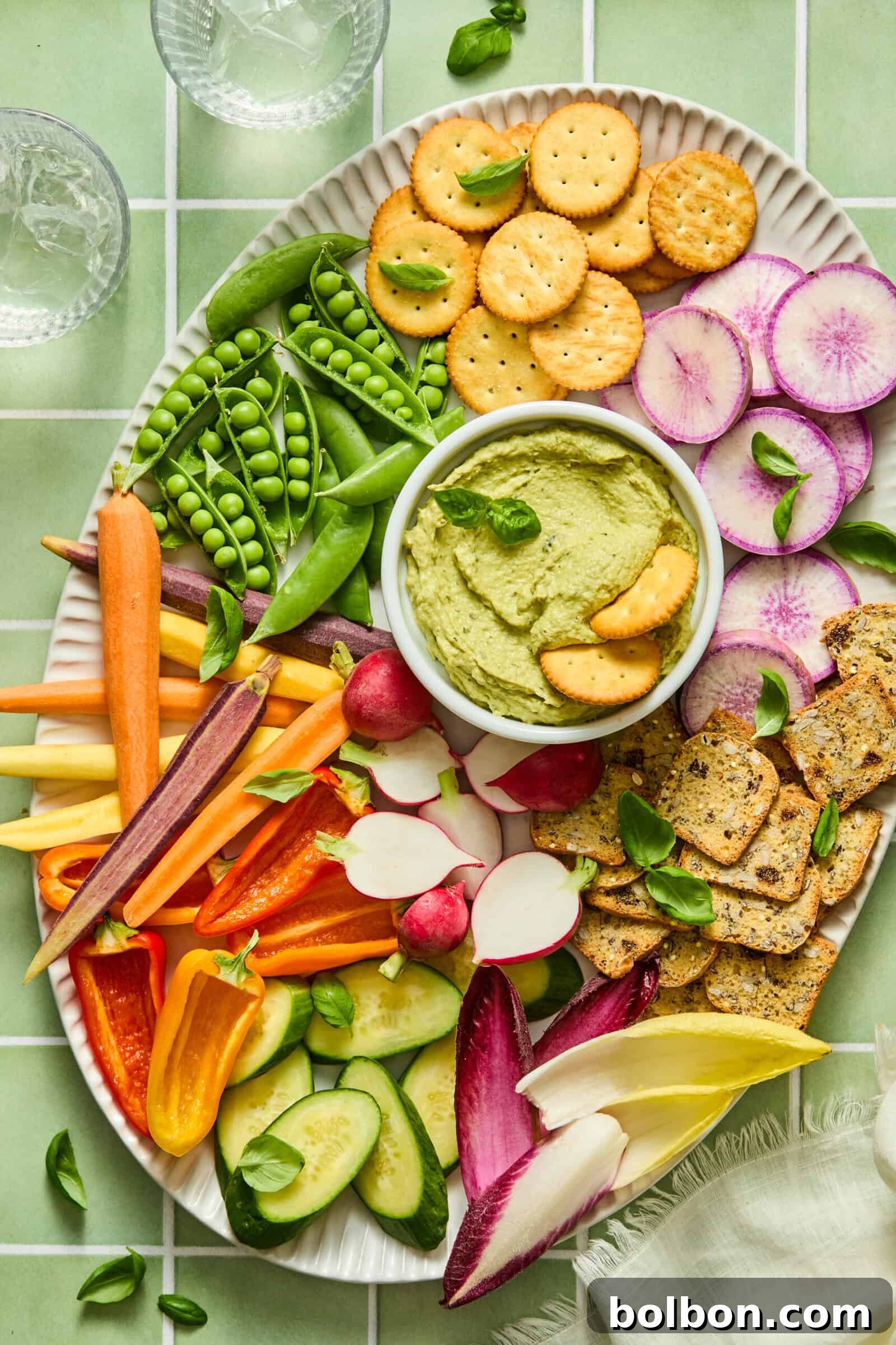 Creamy Tuna and Avocado Dip 4 Colorful vegetable and cracker platter with green hummus dip