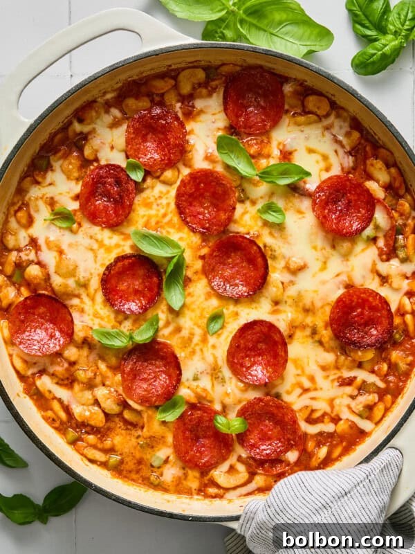 Pizza-Flavored Baked Beans 3 Pepperoni pizza pasta bake in a white skillet