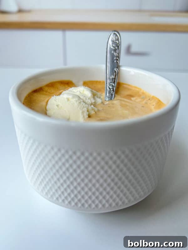Oreo Affogato Recipe: Coffee, Ice Cream & Crushed Oreos 4 A white textured cup filled with coffee and a scoop of vanilla ice cream—a classic affogato recipe