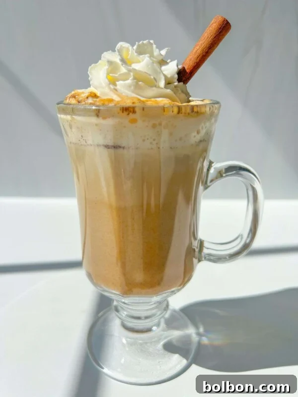 Oreo Affogato Recipe: Coffee, Ice Cream & Crushed Oreos 5 A glass mug filled with a creamy pumpkin spice latte topped with whipped cream