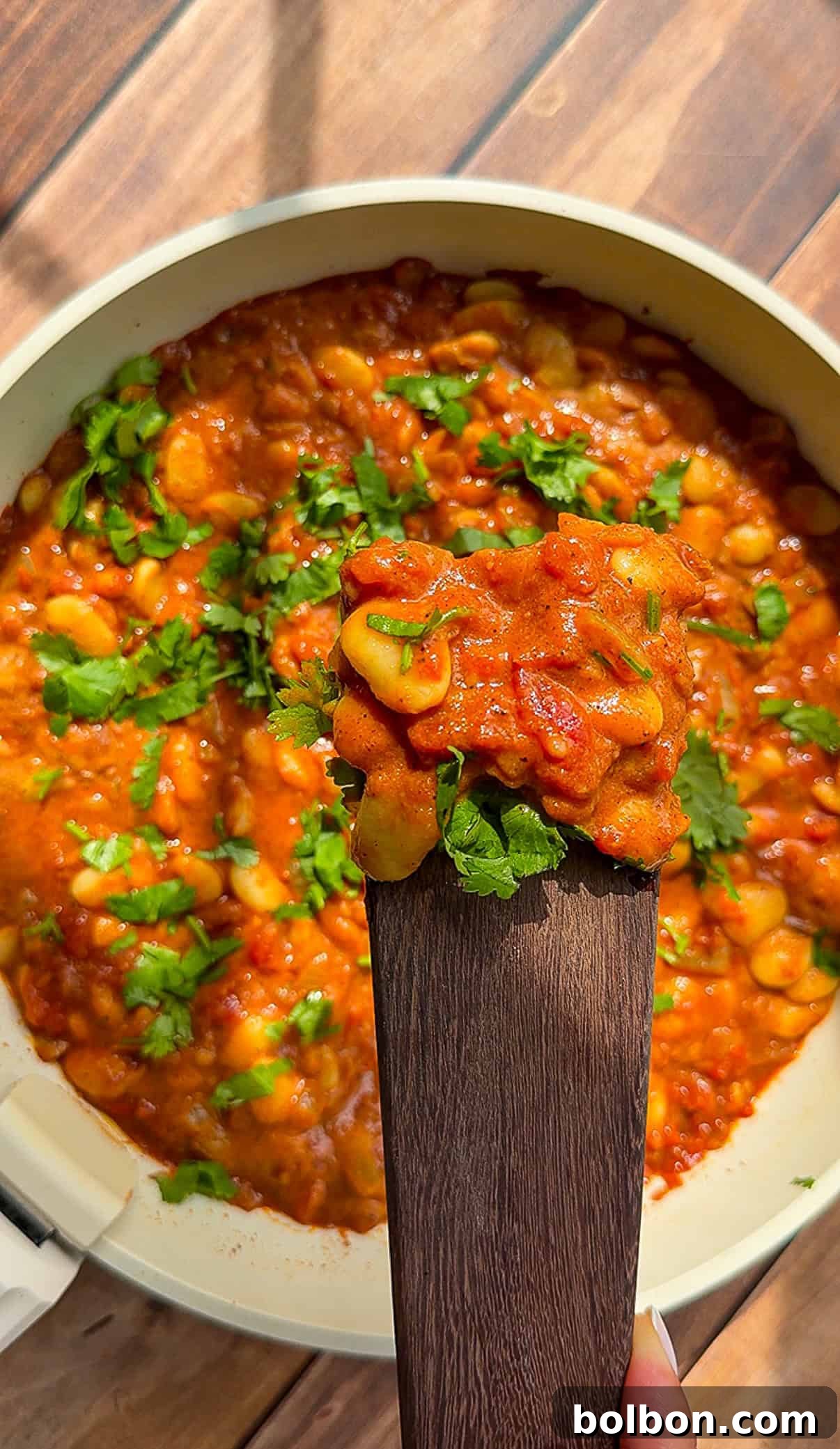 Creamy Butter Chicken Beans: Indian-Spiced Bean Curry 2 Butter Beans Stew garnished with fresh cilantro
