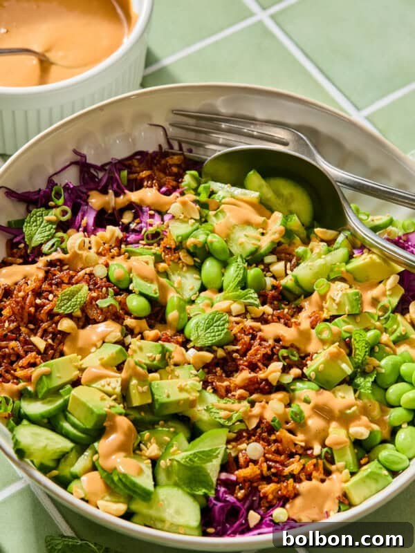 Crispy Rice Salad That Went Viral: Tangy Sesame Crunch 3 Vibrant rice bowl with avocado, edamame, and peanut sauce